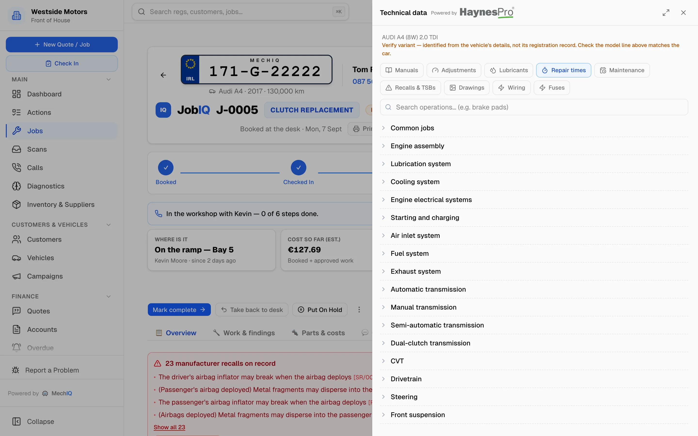 MechIQ's technical data panel showing repair time categories for an Audi A4, beside the live job